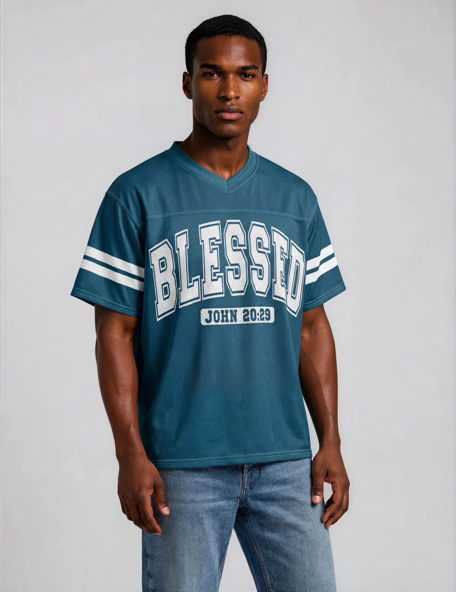 Man wearing a blue 'BLESSED' jersey with white text on a plain background
