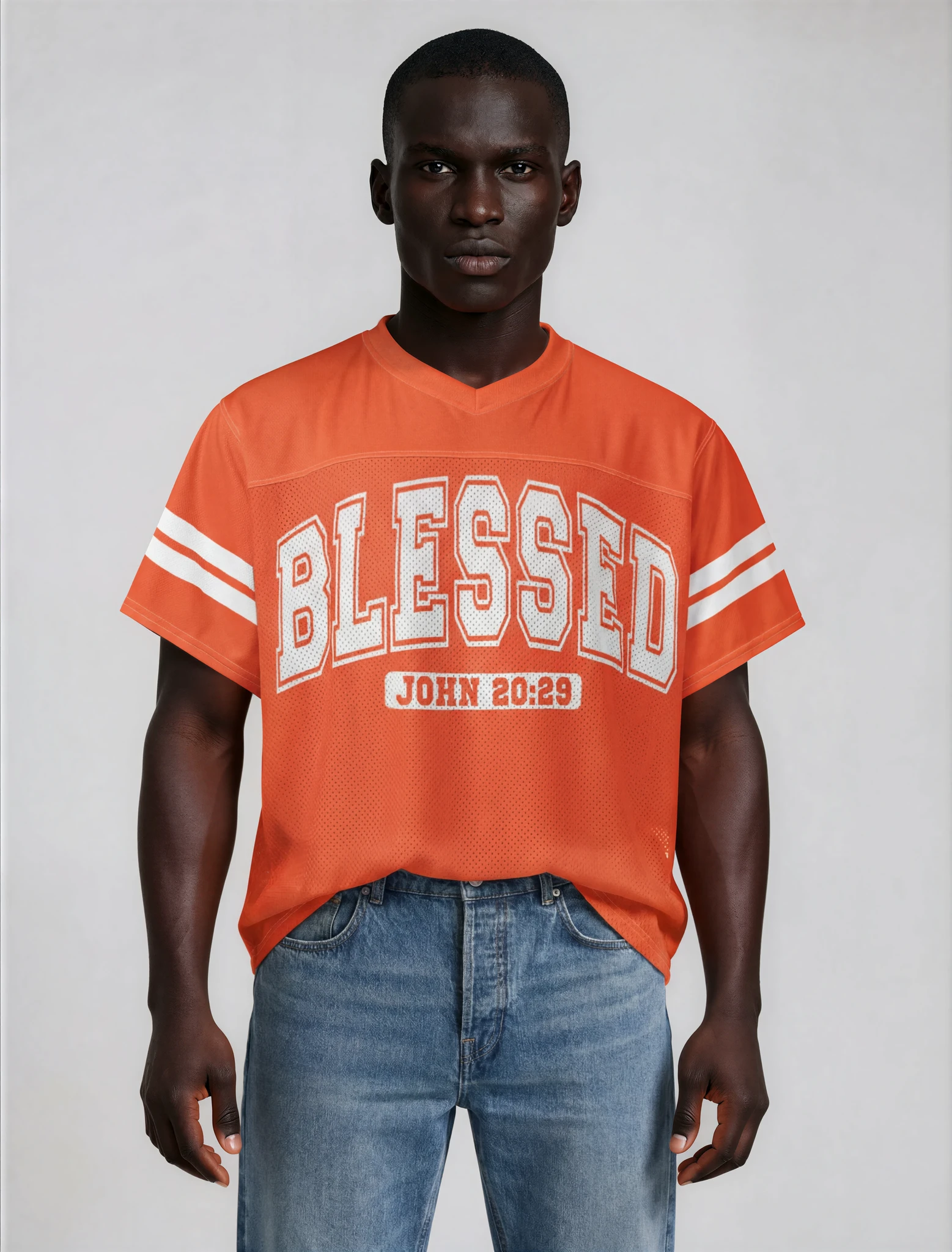Man wearing an orange 'BLESSED' t-shirt with a white background